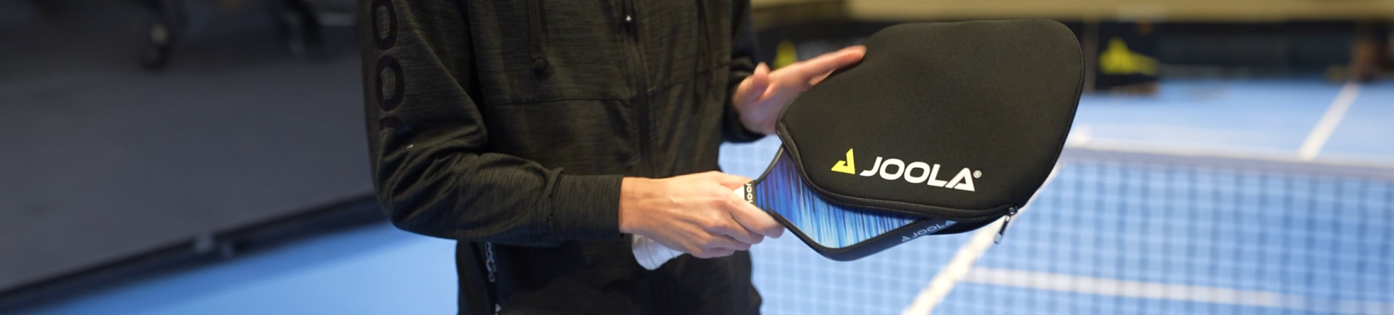 JOOLA pickleball paddle with protective case on court