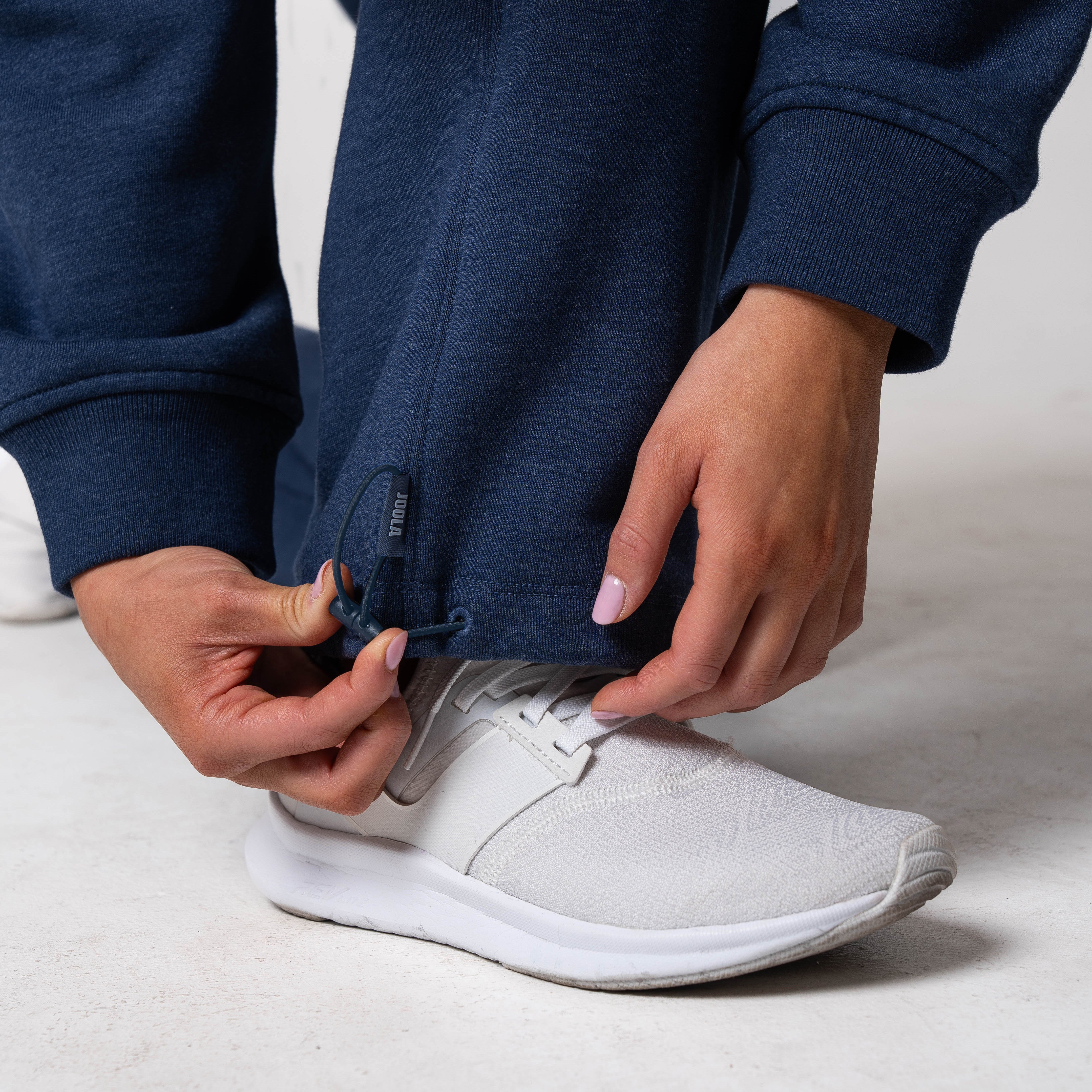 Close up on the detail on the pant cuff of a JOOLA fleece pants (Navy).